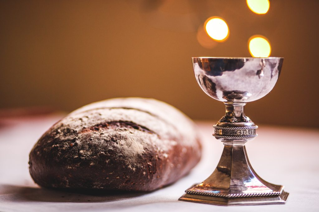 breaking bread and the communion wafer